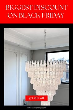 a chandelier hanging from the ceiling in front of a window with text reading biggest discount on black friday get 20 % off