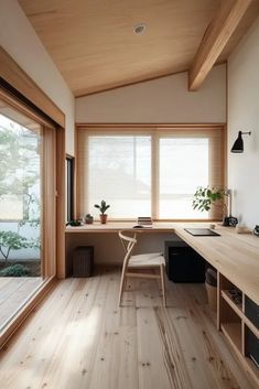 an empty room with wooden floors and lots of natural light coming in from the windows