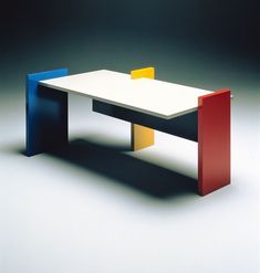 a white table with two different colored sections on it's top and bottom, sitting in front of a black background