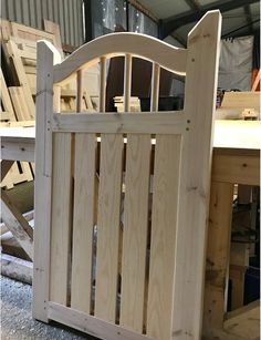 a wooden gate sitting in the middle of a room