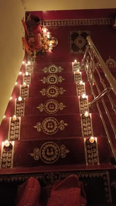 the stairs are decorated with candles and decorations