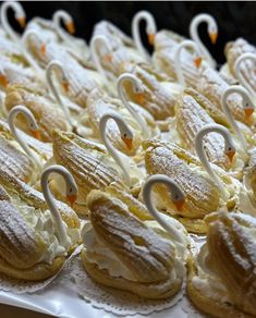 many pastries are decorated with swans on them