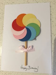 a birthday card with a colorful lollipop on it