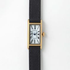 Reminiscent of a tied ribbon, the streamlined silhouettes of yesteryear gave inspiration for Kimsey’s romantic double tour strap and rectangular frame. Minimal Watch, Tied Ribbon, Style Transformation, Unique Watches, Small Watch, Vintage Timepiece, March Hare, Beautiful Watch, Gold Watches Women