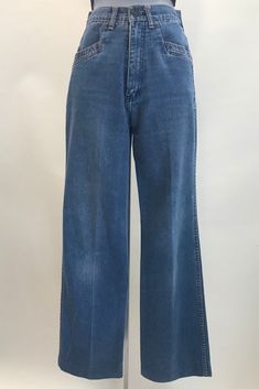 "1970's High Waist Flare Legged Jeans. These jeans were manufactured by \"Red Lips Jeans and Sportswear\" and has an orange stitching detail, it consists of 52% polyester and 48% cotton.  The label lists it as a vintage size 7, with a 25\" waist, although I measured the waist at 24\".  There are two angled pockets in front and two patch pockets with a stitched design in the back.  There is some variation in the denim from what I think is wear, but nothing major and the material is all in good shape.  This garment is in great vintage condition. Measurements: Waist:  24\"  (measured flat then doubled) Hip:  38\"   (measured flat then doubled) Front Rise:  12\" Inseam: 29\" Leg Opening:  17\"  (measured flat then doubled)" Flare Leg Jeans, Womens Jeans, Red Lips, 1970s, High Waist, Women Jeans, Size 7, High Waisted, Clothes For Women