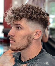 Bird's Nest. These stylish, youthful and cool curly hairstyles for men will embrace your texture and add a modern edge to your look. With short sides and longer curls on top, the broccoli has become a popular haircut style for young Gen Z guys wanting a unique look that will stand out. Messy Fringe Curly Hair Men, Popular Boy Haircuts, Broccoli Haircut, Messy Fade, Messy Fringe Haircut Men, Curly Taper, Hipster Haircuts, Popular Boys Haircuts, Hipster Haircuts For Men