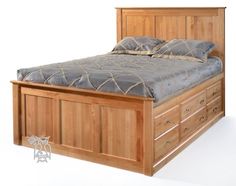 a wooden bed frame with two drawers and a night stand on one side that is made out of wood