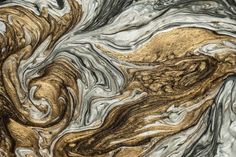 an abstract painting with gold and silver colors on it's surface, as well as black and white swirls