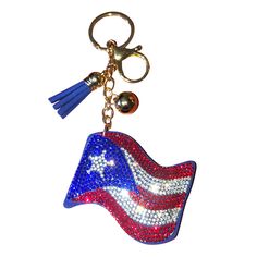 an american flag shaped keychain with a tassel hanging from it's side