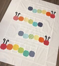 an image of a quilted table runner with numbers and circles on the top half