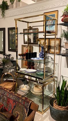 a room filled with lots of different types of furniture and decor on display in glass shelves