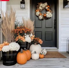 fall front porch decor with pumpkins and flowers