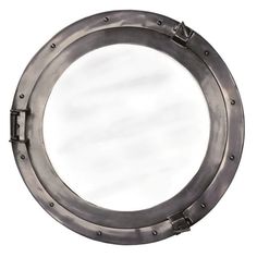 a metal porthole mirror on a white background