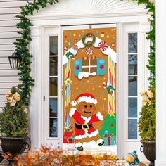 a door decorated with christmas decorations and a gingerbread man on it's front porch