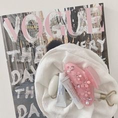 a pink and white bag with some items in it next to a sign that says yogurt