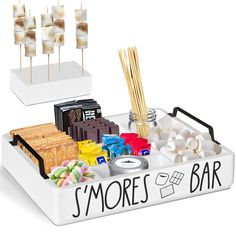 there is a tray with different types of food on it and the words s'mores bar