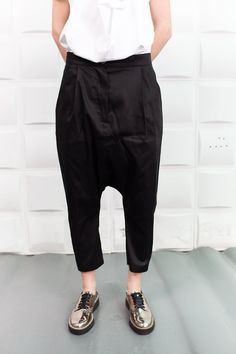 "Black Harem Pants, Cyberpunk Clothing, Drop Crotch Pants These comfortable baggy pants have a drop crotch design an are with an ankle length so these relaxed black cotton pants will make your style trendy and unique and keep you comfortable in your daily activities. ------------------------------------------------ FEATURES: 🌟 Made of cotton fabric 🌟 Two pockets on each side 🌟 Sizes from XS to 5XL - plus sizes available, please write us /the model is wearing size S/ 🌟 Available in black, whi Oversized Black Casual Harem Pants, Black Relaxed Fit Drop Crotch Pants, Black Baggy Drop Crotch Harem Pants, Black Wide-leg Harem Pants With Side Pockets, Avant-garde Black Baggy Pants, Black Harem Pants, Cyberpunk Clothes, Baggy Pants, Drop Crotch Pants