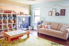 the living room is clean and ready for us to use as a playroom or office