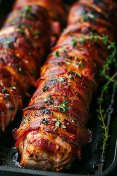 some meat wrapped in bacon and garnished with parsley