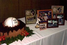 a table topped with a cake covered in baseball memorabilia