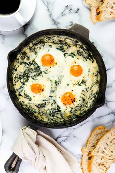 an egg and spinach frittata in a cast iron skillet on a marble countertop