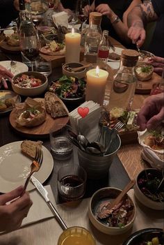 a group of people sitting around a dinner table