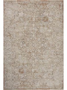 an antique style rug in beige and brown tones