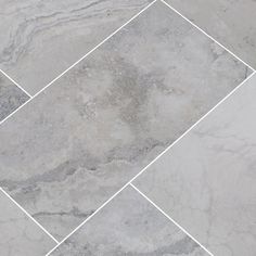 a tile floor with grey and white colors