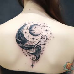 a woman's back with a crescent and stars tattoo on it