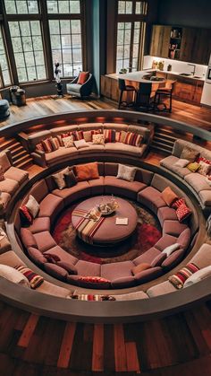 a large circular couch in the middle of a living room