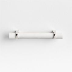 a white wall mounted toilet paper holder