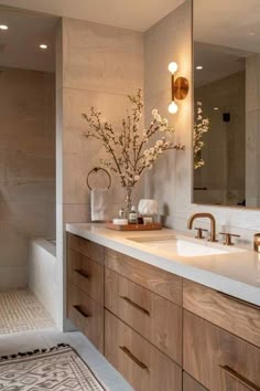 a bathroom with two sinks and mirrors in it