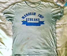 "Manheim Township Streaks T-shirt from J.Crew. Mock Team Tee. The Condition has seen better times and behaved north of grunge in days passed.  The way this measures out along with its age is comparable to Benjamin Button for Vtg Clothing. Rather than a S being a modern XS. This went the other way into damn near a large-Medium. ------ ------ ------ Tag reads Small Measurements:  Across the chest: 20 Length top to bottom: 24.75 ------ ------ ------ Wearable Junk Equaling a Totaled trash (to some) is currently up for sale! No illusions or Trickery.  What you see is exactly what you'll get (as always) Includes all the Bells and Whistles of being a 100% Completely Trashed and Beyond Distressed Clothing article. Hope for Repair has packed up and went skateboarding way beyond the U.S. border. Hit Benjamin Button, Beyond Repair, Pack Up And Go, Black Beards, Pocket Tshirt, Skateboarding, Columbus, J Crew, Adult Outfits