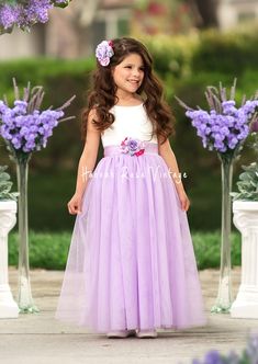 Dress your little one in elegance with our Lavender Sleeveless Tulle Flower Girl Dress! Featuring a soft white lace bodice and flowing lavender tulle skirt, it pairs perfectly with our matching bridal accessories for Romantic, Shabby Chic, Vintage, Modern, and Classic Wedding Themes. Ideal for portraits and parties. How to Order: Dresses are true to size. Please measure to ensure best fit. *Select your preferred sash style and then leave the sash color in the cart notes at checkout. Additional O Lavender Flower Girl, Lavender Flower Girl Dress, Bohemian Flower Girl Dress, Dance Portraits, Burgundy Flower Girl Dress, Vintage Flower Girls, Flower Girl Dresses Vintage, Rustic Flower Girl Dress, Boho Flower Girl