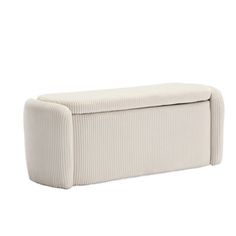 an upholstered bench with a white cover