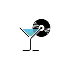 a martini glass with a record on the rim