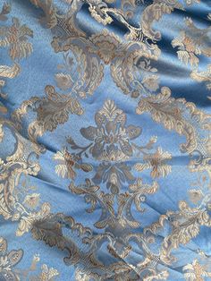 Designer brocade satin fabric in a beautiful sky blue colored damask motif. Great for interior design upholstery and more: pillows, comforters, sofas, drapes. Also for Fashion: Coats, Blazers, Dresses and Vests. Sold by the yard. Fabric Width: 110 inches Will combine shipping. Photo on the right is for inspirational purposes only. It is not made of the actual fabric but of similar fabric. The photos of the fabric is the actual fabric being sold. Due to the nature of cutting yardage we cannot acc Sky Blue Fabric, Sofa Fabric, Floral Print Fabric, Fabric Sale, Brocade Fabric, Yellow Fabric, Beautiful Sky, Italian Fabric, Fabric Width