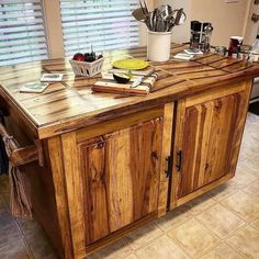 a kitchen island made out of wooden cabinets