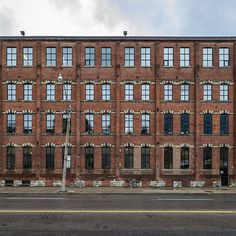 an old brick building with lots of windows