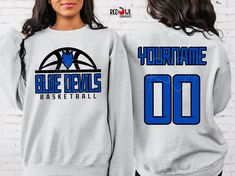 Personalized Blue Devil School Spirit T-Shirt Crewneck, Hoodie Hooded Sweatshirt Football, Baseball, Basketball, Softball, Track, Volleyball, Cross Country, Cheer, Wrestling Not all colors are available in all sizes and styles.  Please check the color and size charts in photos. We do our best to accurately represent shirt colors by using actual photos but do understand that all monitors will display differently. Please contact us prior to purchase with any questions on sizing or colors. Your purchase includes a custom imprint created specifically for your team! A product proof will be emailed to you within 1 business day.  Please keep an eye on your Etsy messages and reply with any changes within 24 hours. Your order will be sent to production after that time if no response is received. Ex Relaxed Fit Blue Pre-shrunk Sweatshirt, Blue Relaxed Fit Pre-shrunk Sweatshirt, Blue Crew Neck Sweatshirt For Sports Events, Blue Team Spirit Hoodie With Team Name, Blue Crew Neck Hoodie Fan Apparel, Blue Crew Neck Sweatshirt For Fan Merchandise, Blue Long Sleeve Pre-shrunk Hoodie, Blue Crew Neck Sweatshirt With Team Spirit, Blue Pre-shrunk Sweatshirt For Streetwear