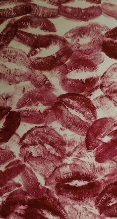 an artistic drawing of red feathers on white paper