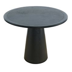 a round wooden table with black base