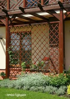 an outside view of a house with plants and flowers