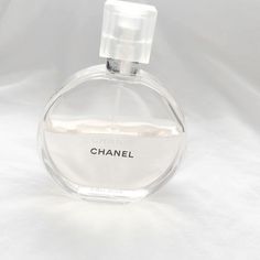 a bottle of chanel perfume on a white background