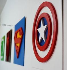 the wall is decorated with superhero logos