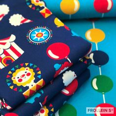 circus themed fabric with clowns and balloons on blue, green, red, yellow or orange colors