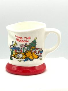 there is a coffee cup that has the words twas the beacon on it and cartoon characters around it