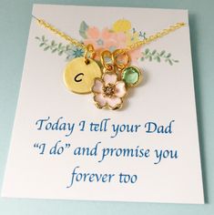 a card with a flower and two charms on it that says today i tell your dad i do and promise you forever too