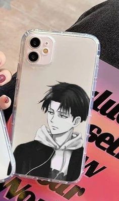 a woman holding up a phone case with an anime character on the front and back