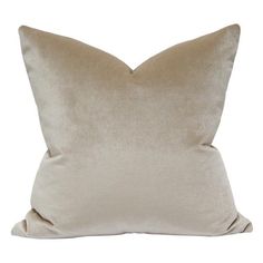 a beige pillow on a white background